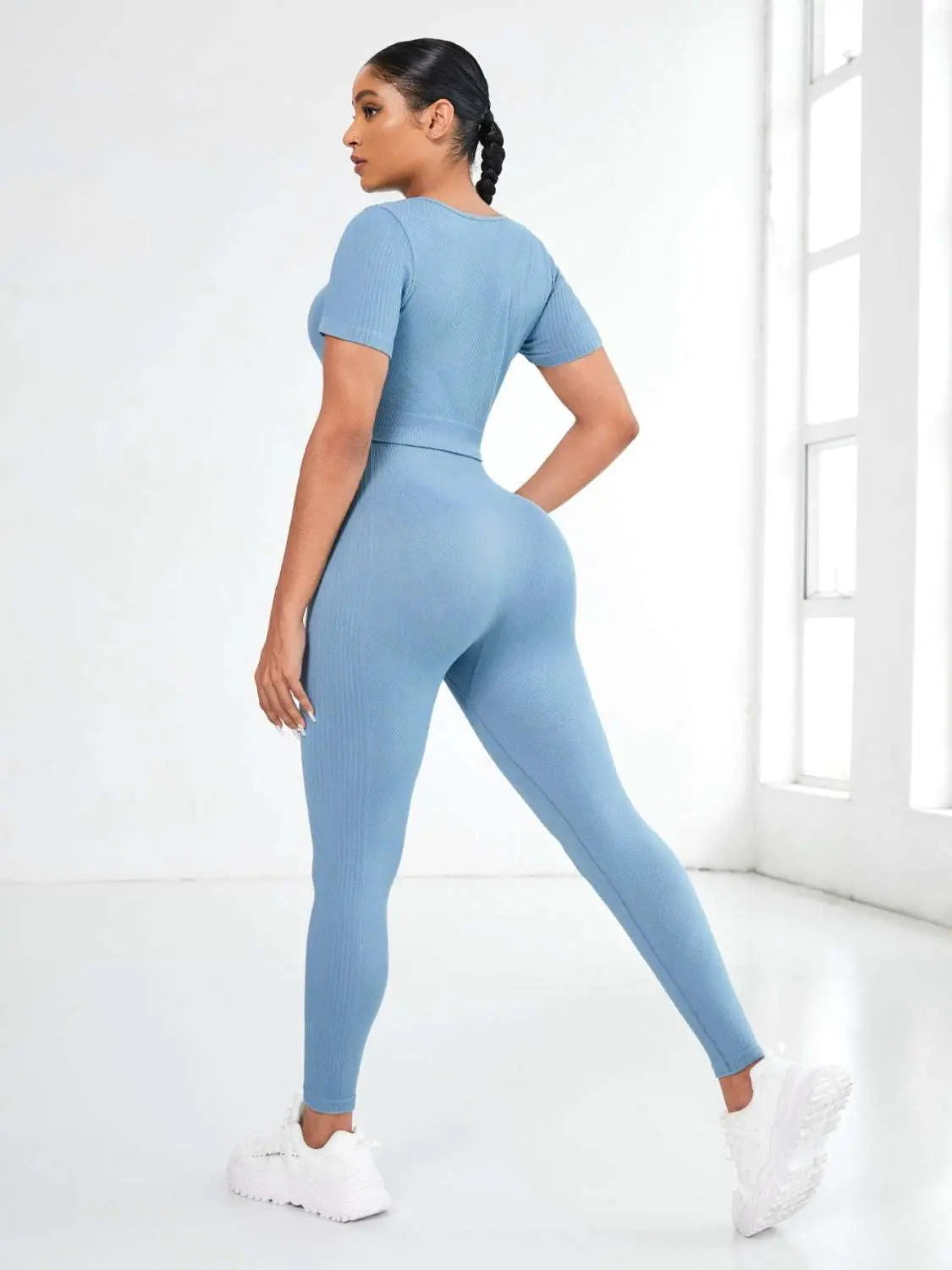 Round neck short sleeve top and leggings active set in blue with moderate stretch.