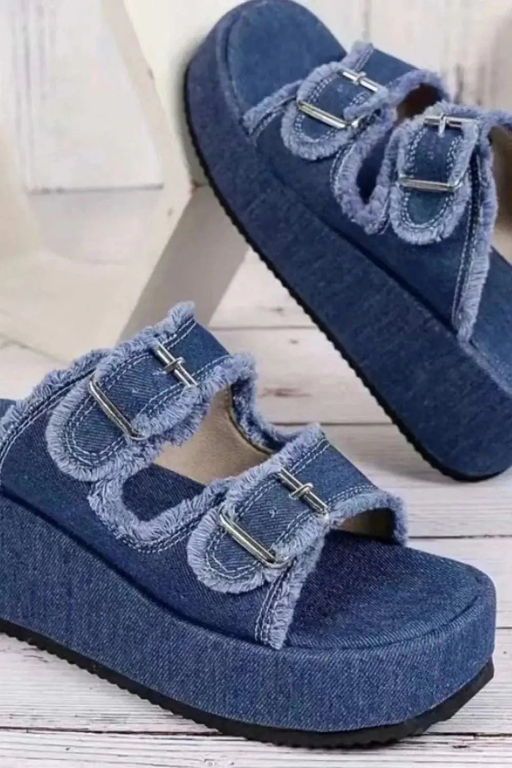 Raw Hem Wedge Buckle Sandals with mid heels in rubber and cloth.