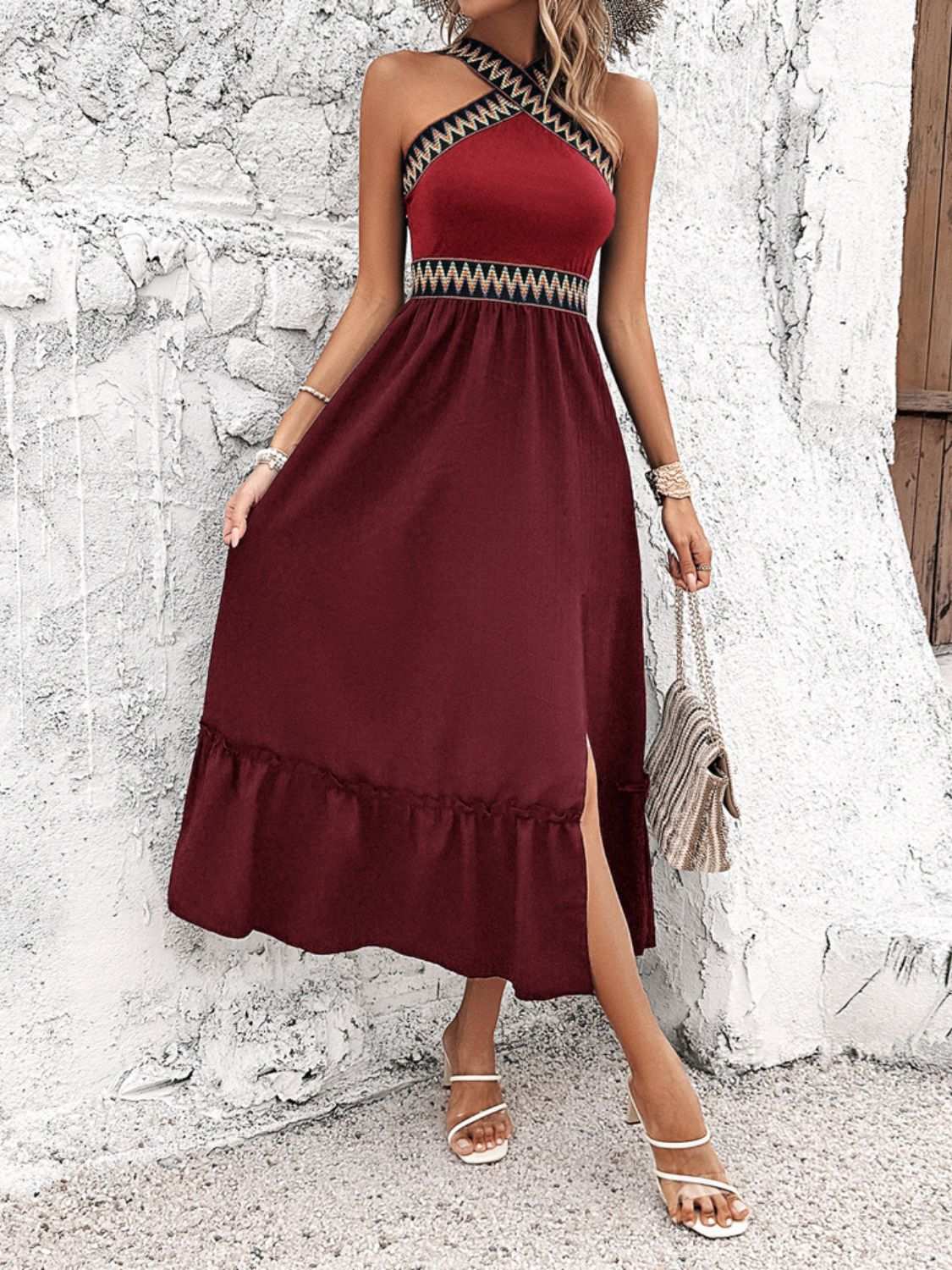 Devine Ruffled Slit Sleeveless Midi Dress in burgundy with geometric neckline detail, featuring a stylish slit and ruffled hem.