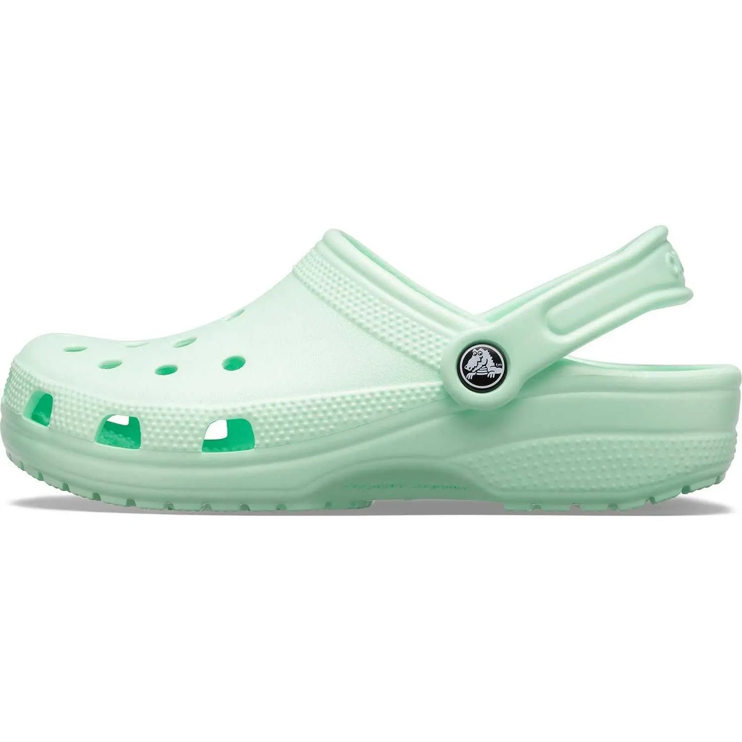 Light green Crocs Unisex-Adult Classic Clogs showcasing ventilation ports and signature comfort.