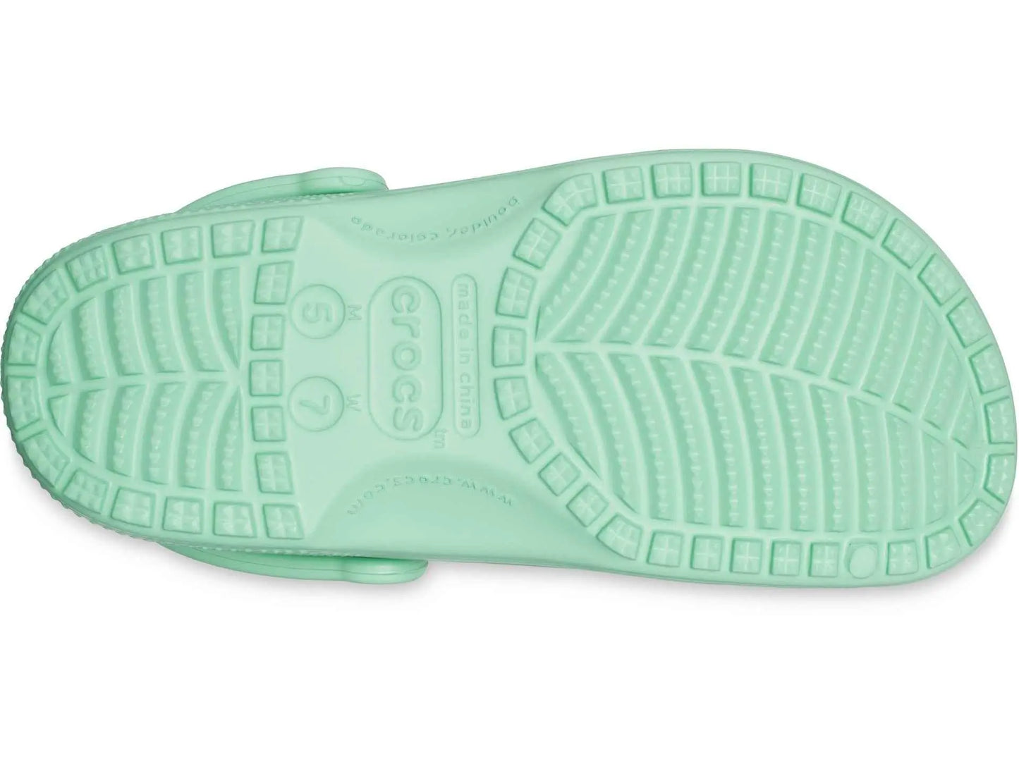 Bottom view of Crocs Unisex-Adult Classic Clogs showcasing the sole design in light green.