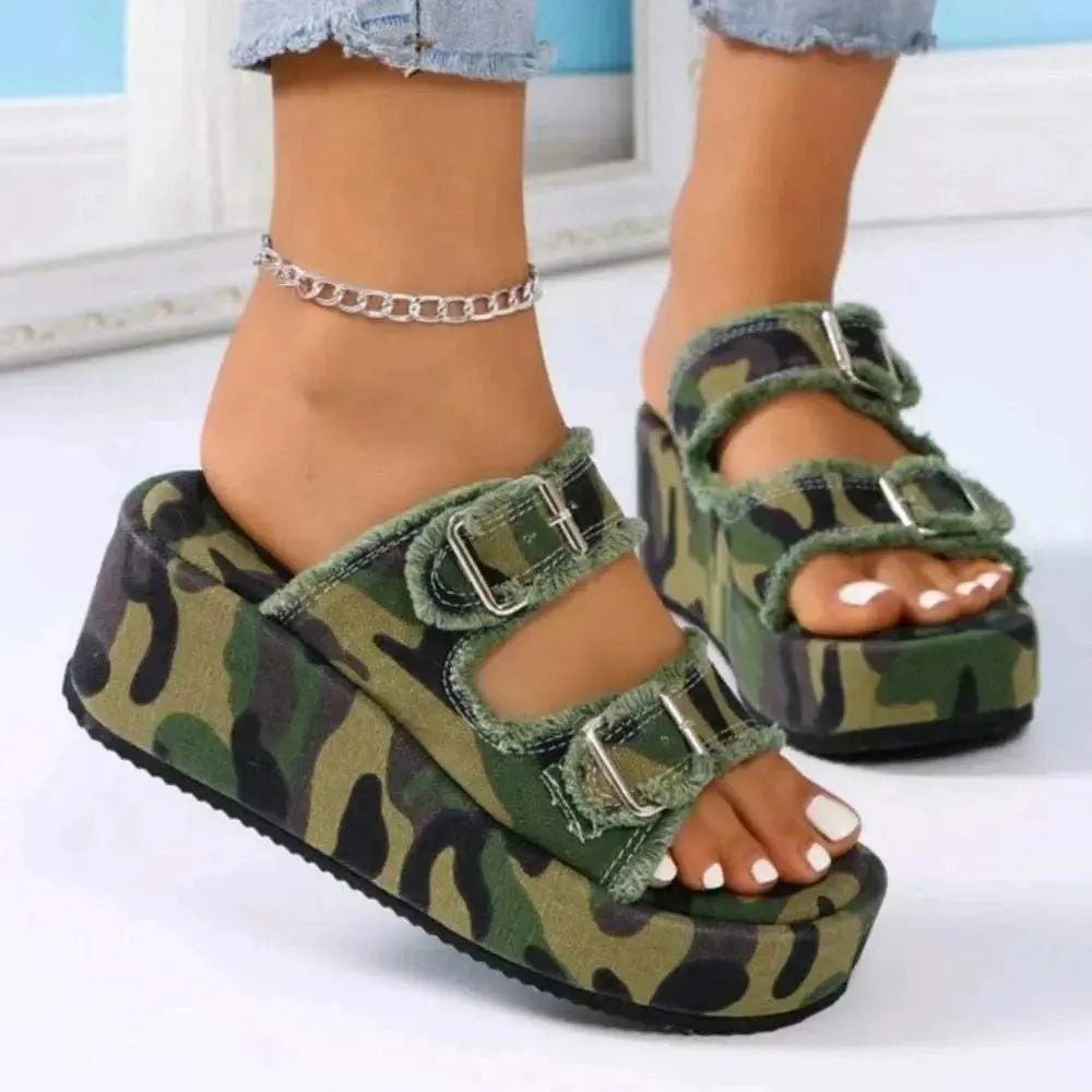 Raw hem wedge buckle sandals with mid-height heels in camouflage pattern.
