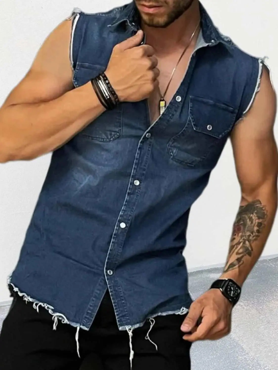Men's snap down sleeveless denim shirt, pocketed, buttoned style.