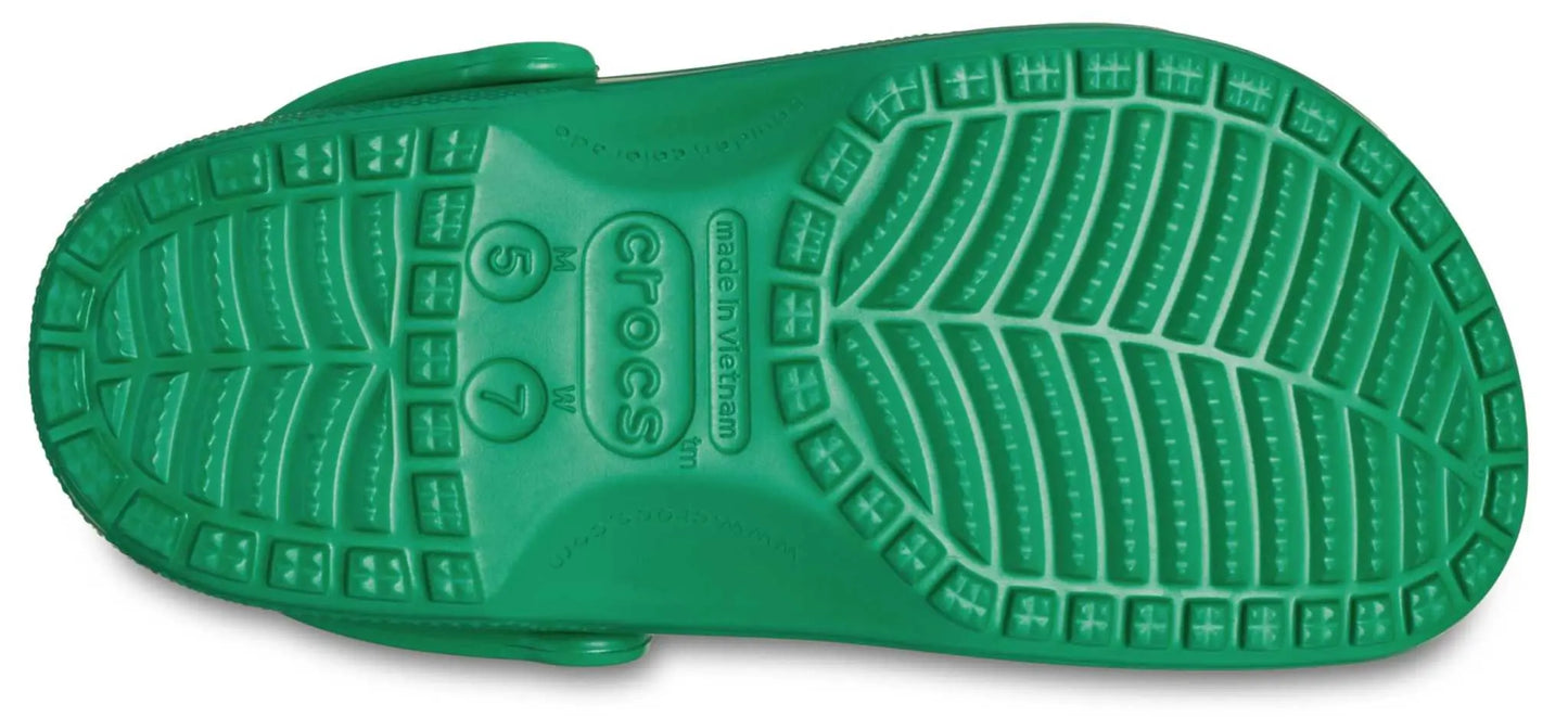 Sole of Crocs Unisex-Adult Classic Clogs in green.