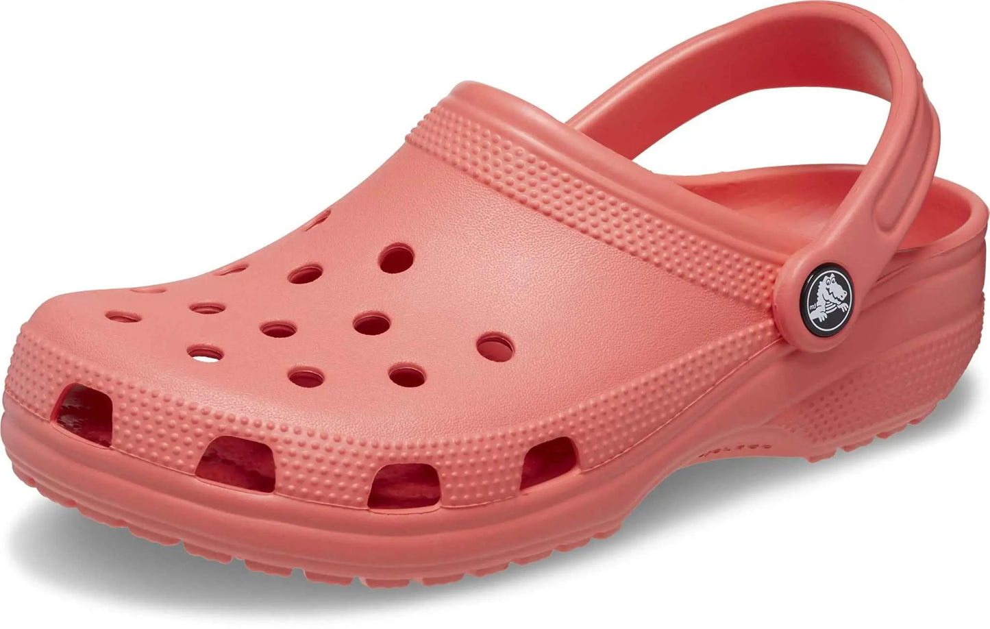 Crocs Unisex-Adult Classic Clogs in coral color with breathable ventilation ports.