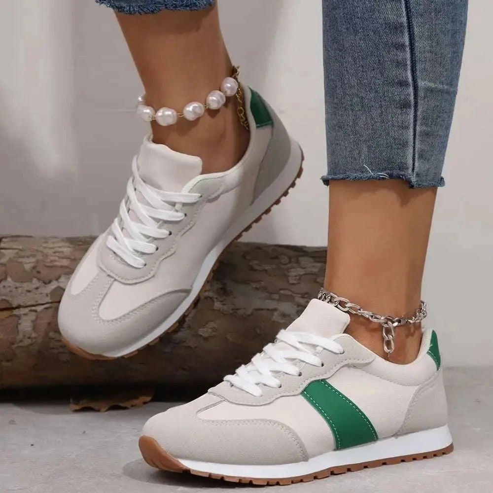 PU leather contrast round toe flats sneakers with green accents.