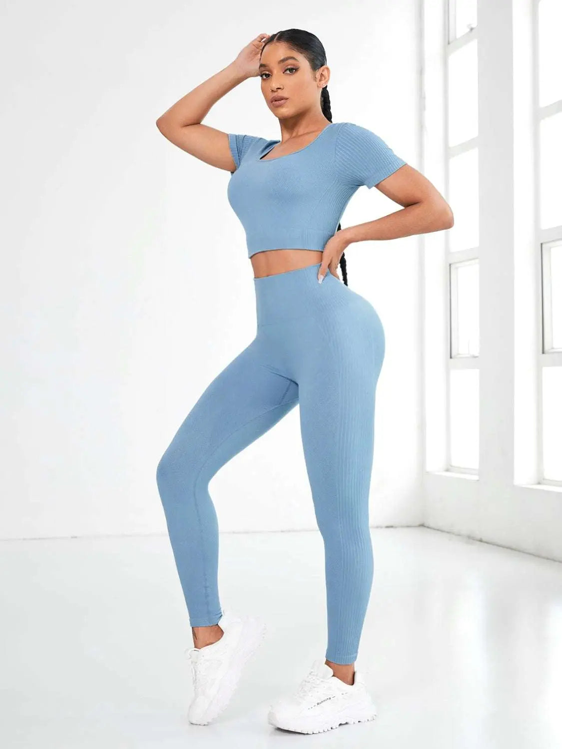 Round neck short sleeve top and leggings active set in blue, featuring a basic style with moderate stretch.