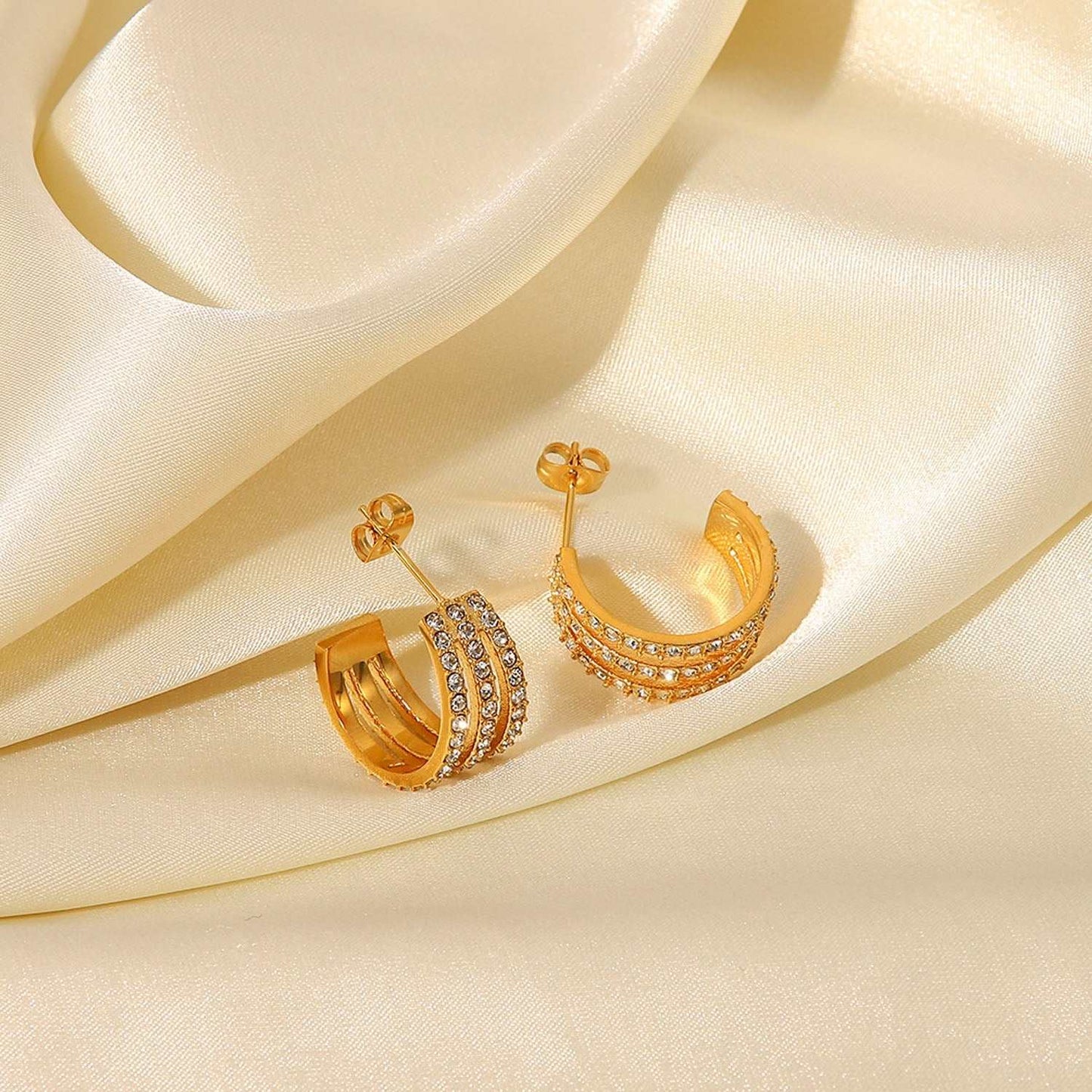 Stainless steel inlaid zircon C-hoop earrings, gold-plated, 2.4-inch length.