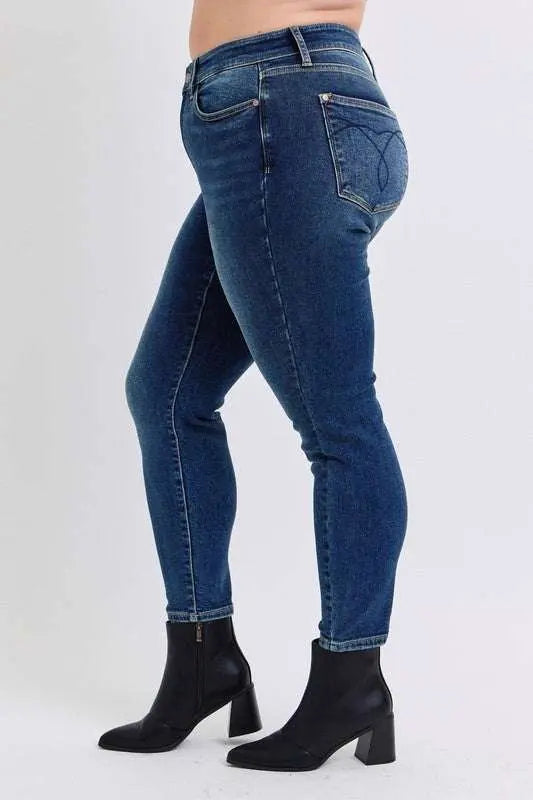 Judy Blue mid-rise skinny jeans with thermal lining, side view, featuring pockets and moderate stretch.