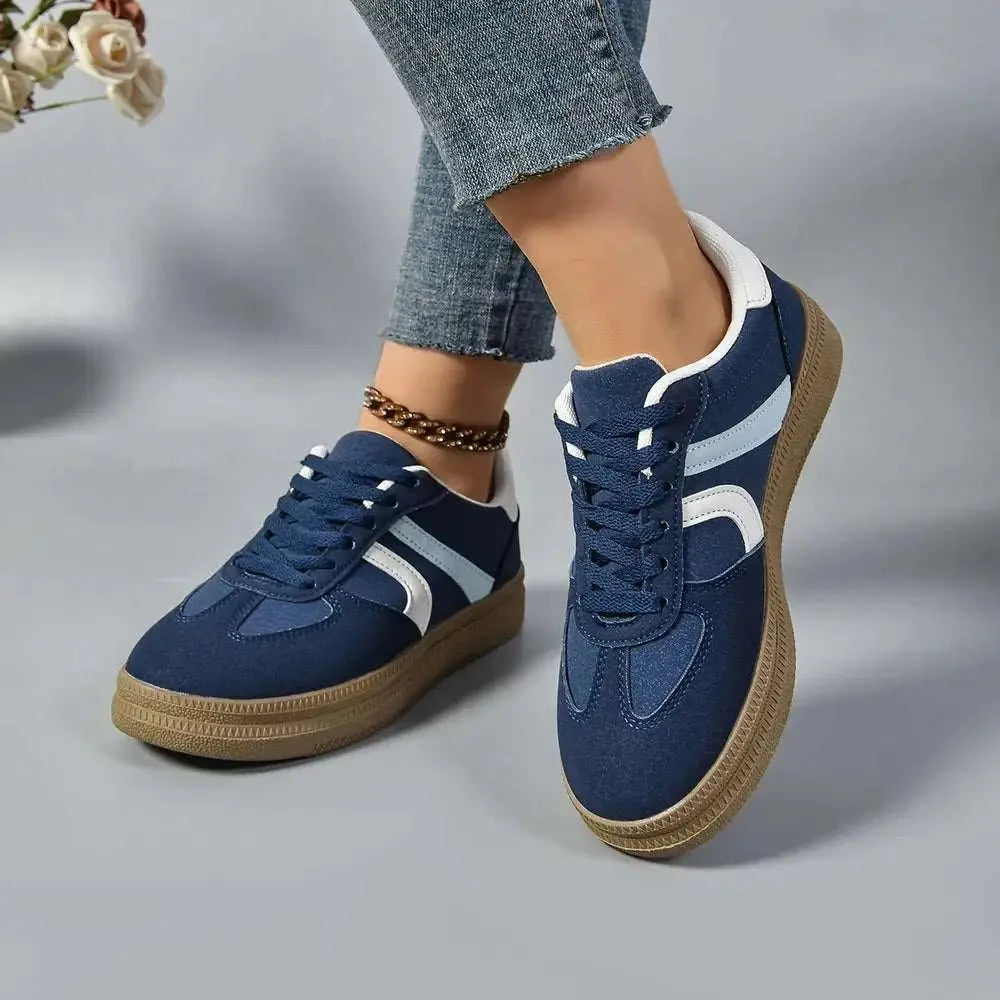 Lace up round toe contrast sneakers in blue with rubber sole.