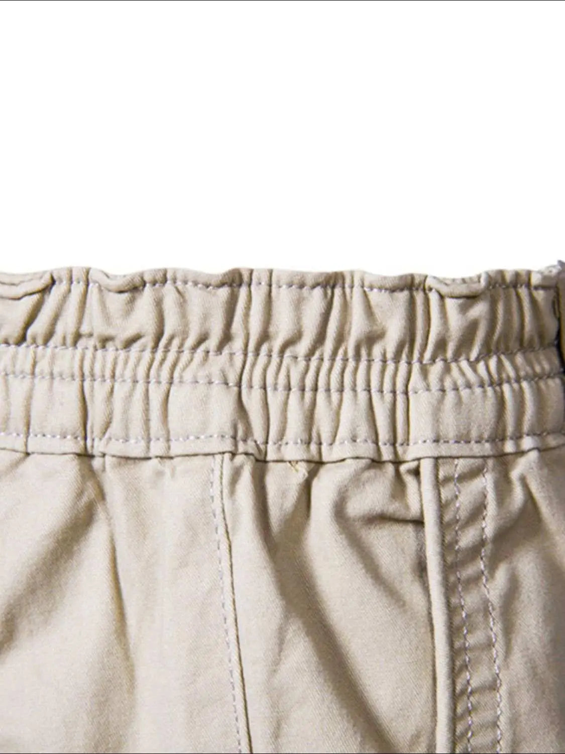 Men's elastic waist cotton shorts with pockets, beige color.