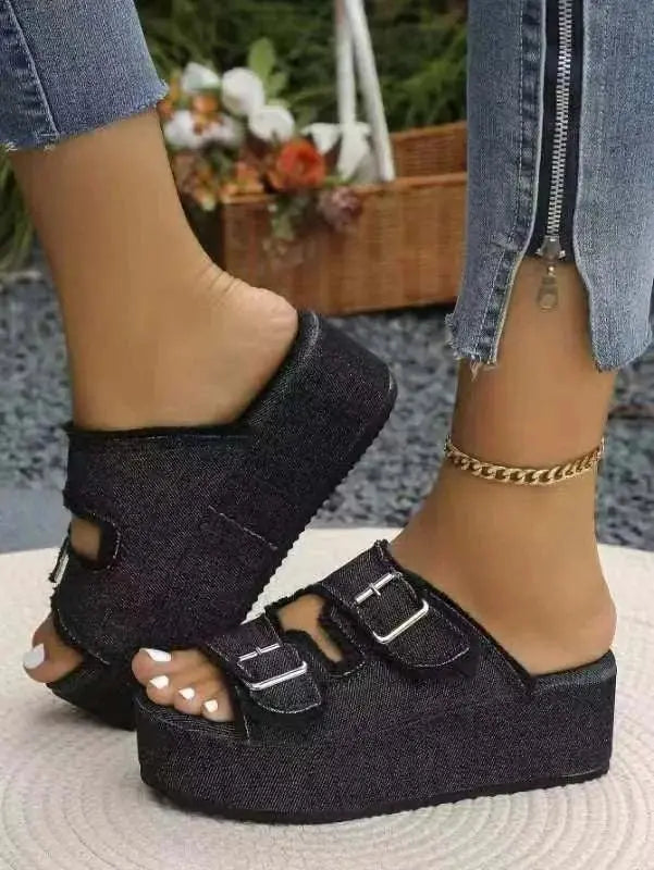 Raw hem wedge buckle sandals with mid heels in black, featuring rubber and cloth material.