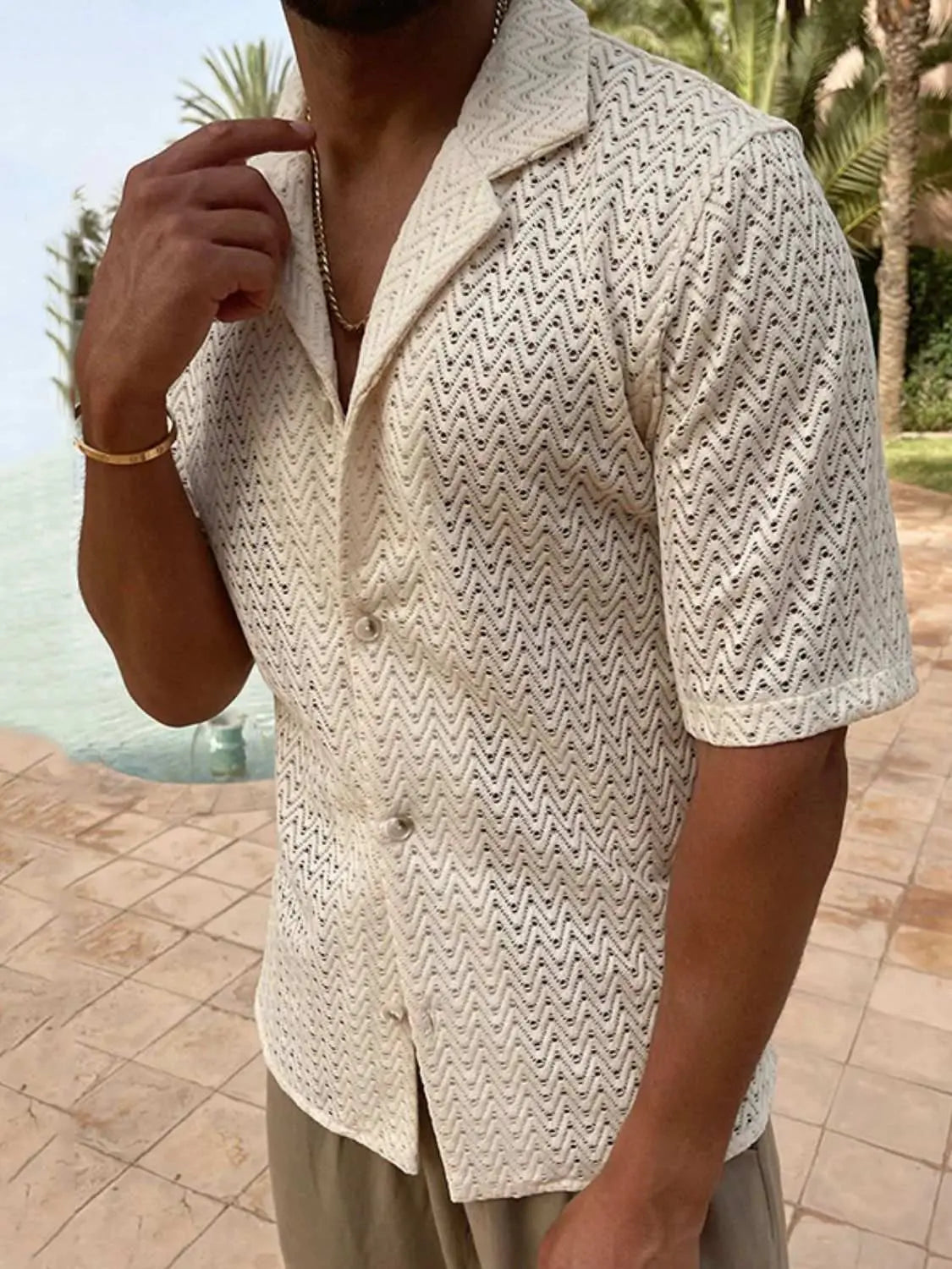 Men's plus size herringbone eyelet button-down knit shirt in cream, short sleeves, slightly stretchy fabric.