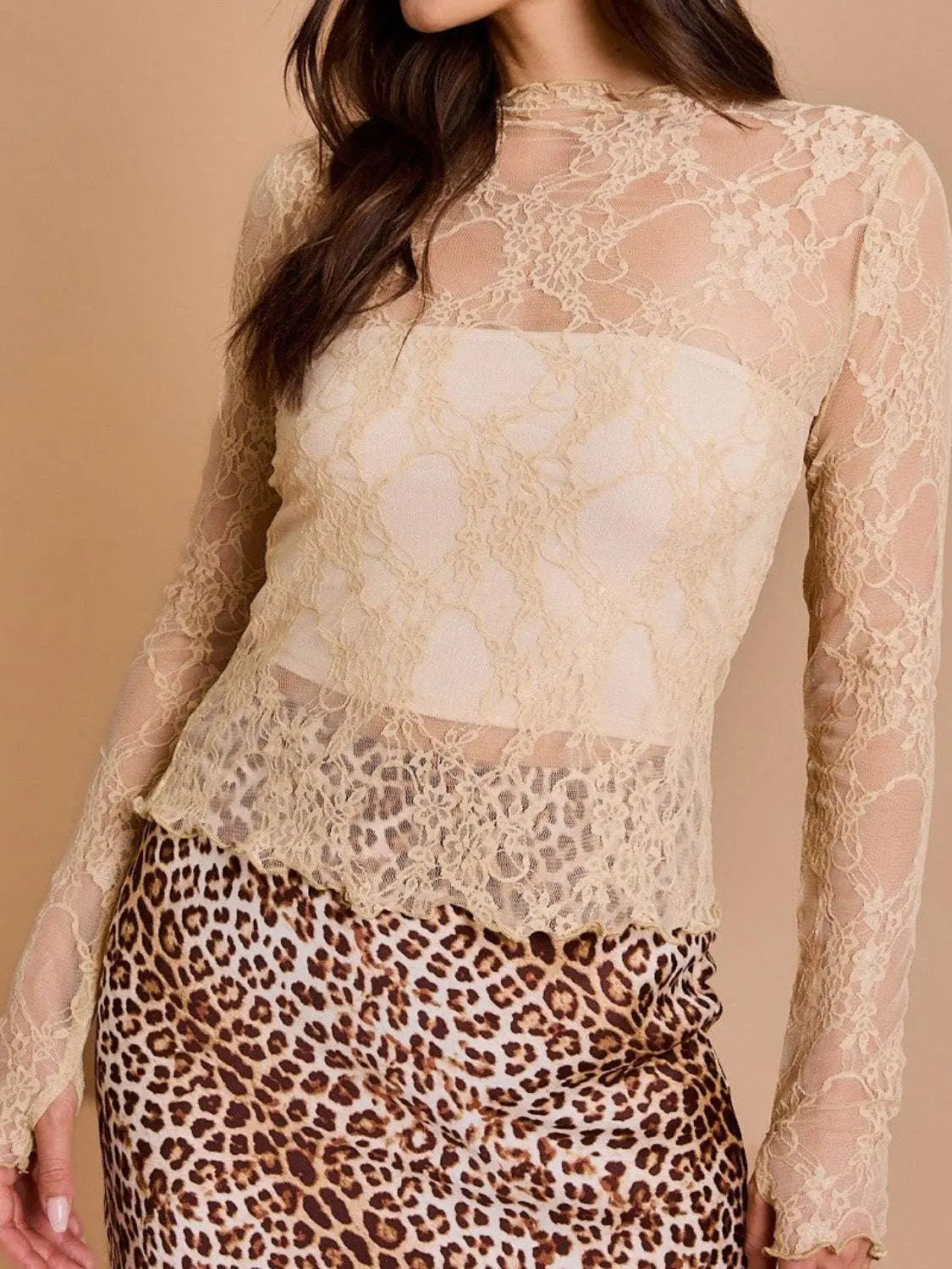 Lace mock neck long sleeve top, sheer and slightly stretchy fabric, styled with a leopard print skirt.