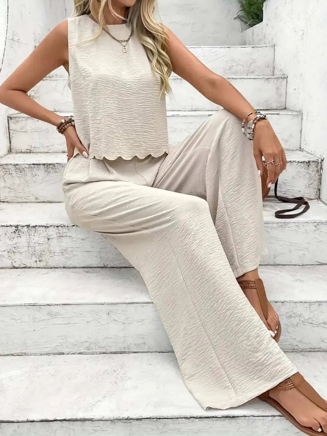 Tie back round neck top and pants set in beige, sleeveless, wide-leg design.