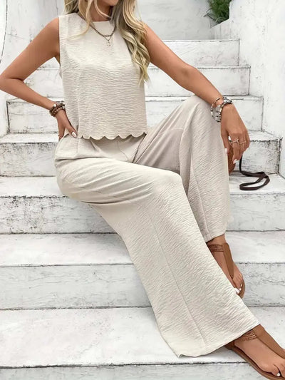 Tie back round neck top and pants set in beige, sleeveless, wide-leg design.