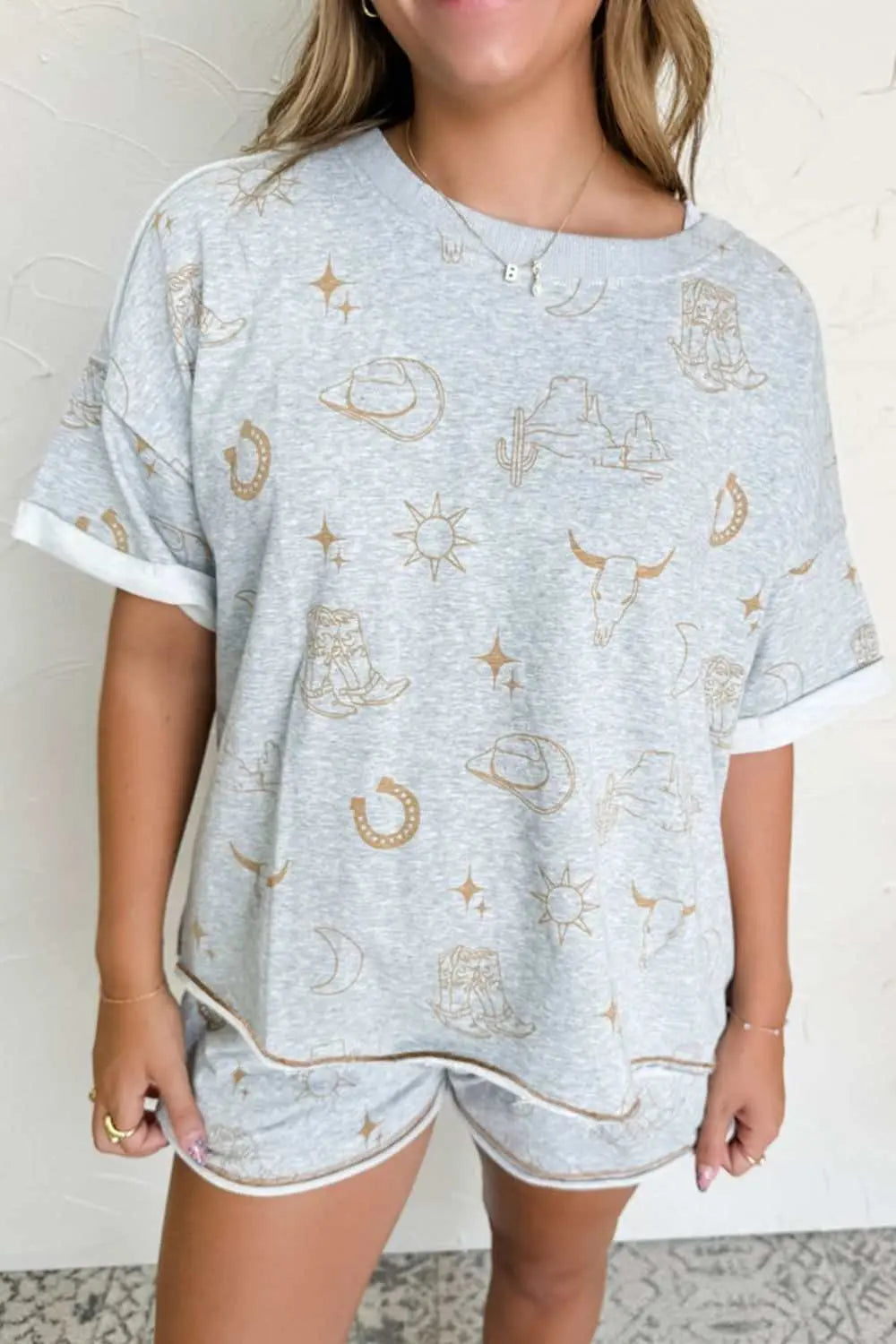 Printed T-shirt and shorts set with Western-themed graphics, featuring no stretch and made of polyester-elastane blend.