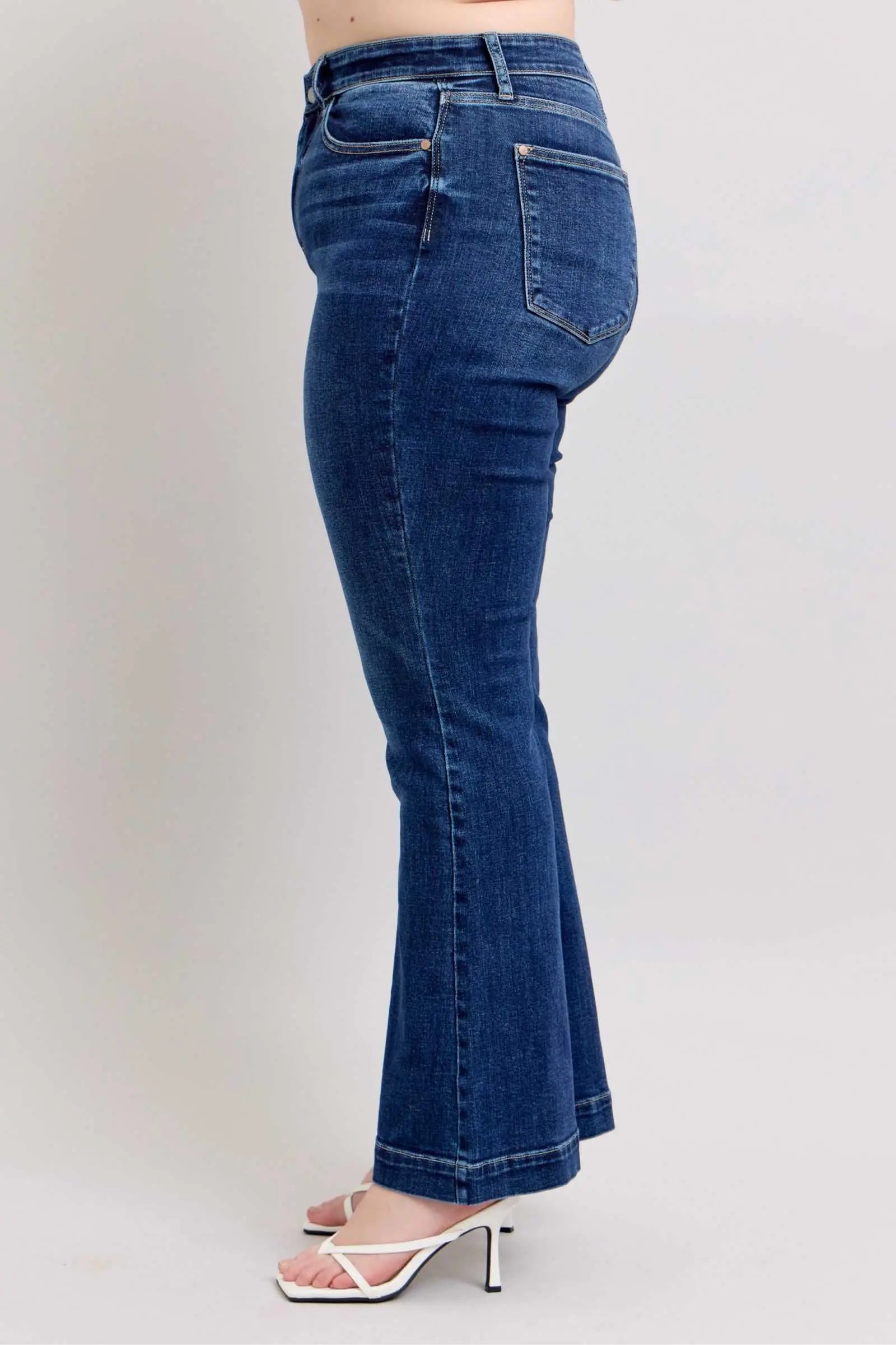 Judy Blue Full Size High Rise Flare Jeans with Pockets Plus Size, dark wash, side view.