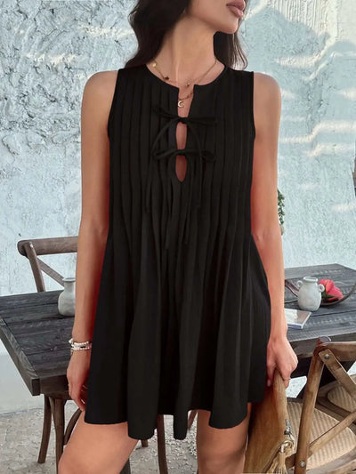 Devine pleated sleeveless mini dress with tie detail, black, 100% polyester.