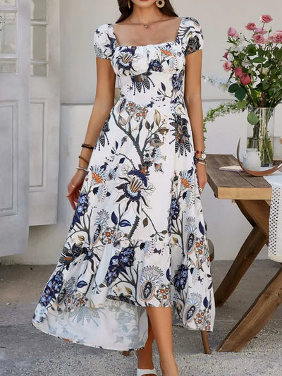 Devine Smocked Printed Short Sleeve Maxi Dress with floral design, featuring smocked detail and a flowy silhouette.