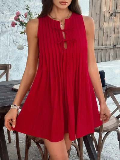 Devine Pleated Sleeveless Mini Dress in red, featuring tied and pleated design.