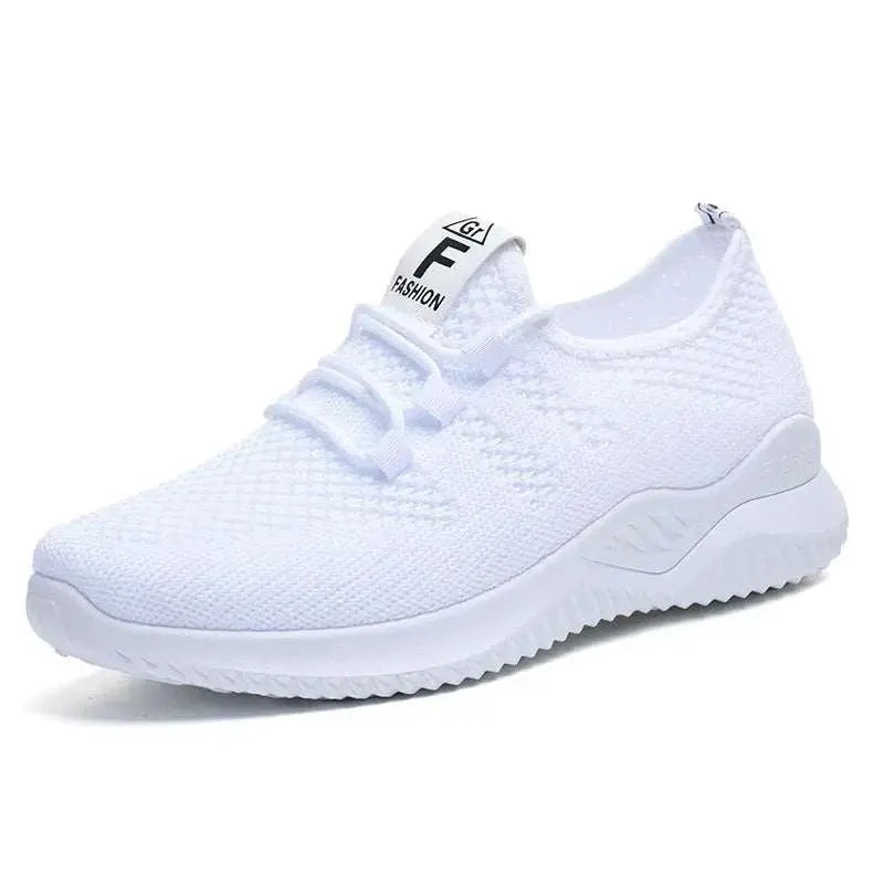 Breathable mesh lace-up athletic shoe in white with rubber sole.