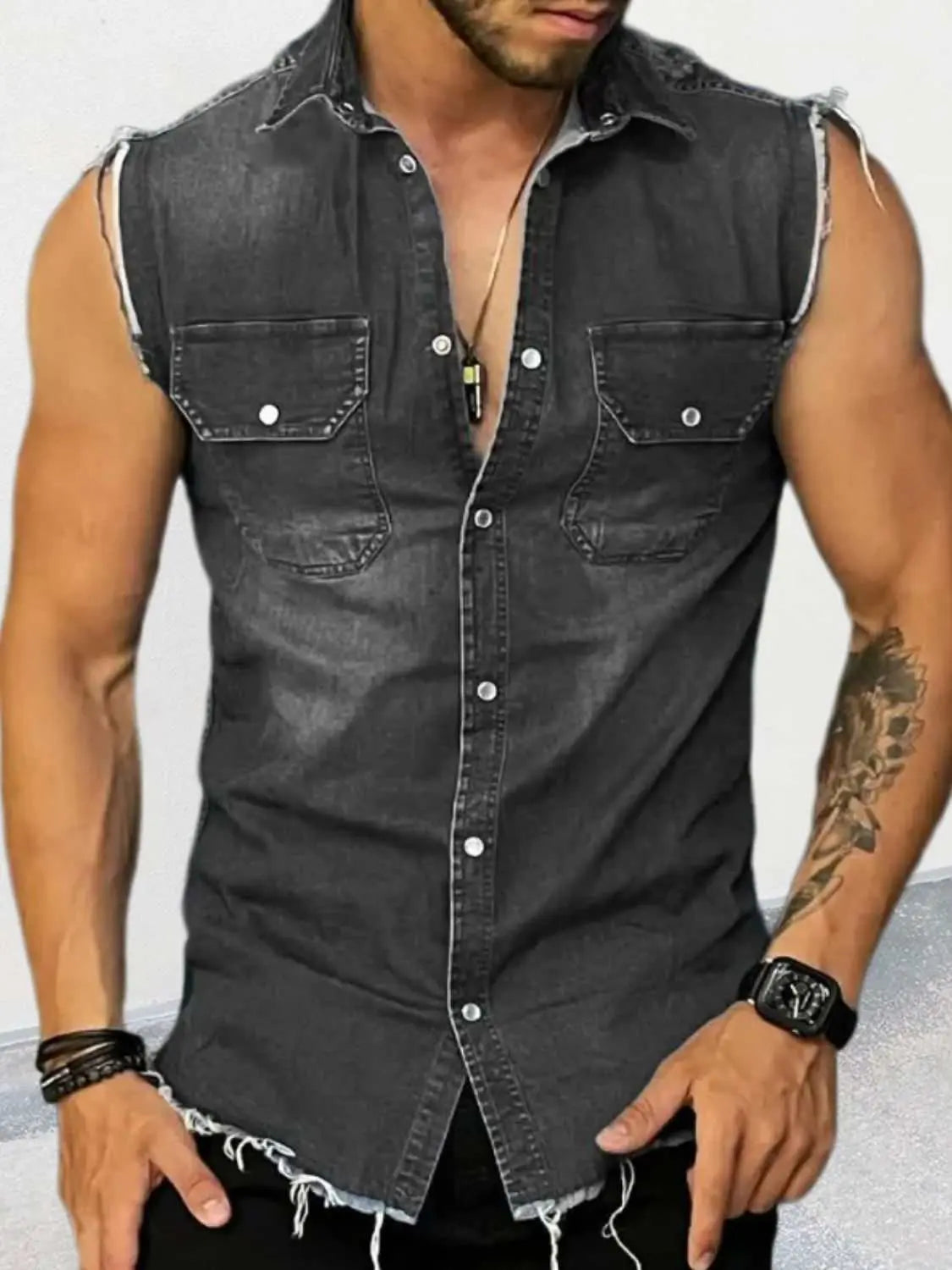 Men's sleeveless denim shirt with snap-down buttons and pocket details.