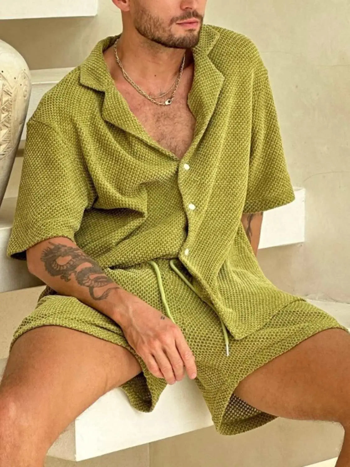 Men's plus size button down half sleeve top and shorts set in green knit fabric.
