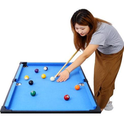 5-in-1 Game Table featuring billiards with a blue surface, person enjoying a game.