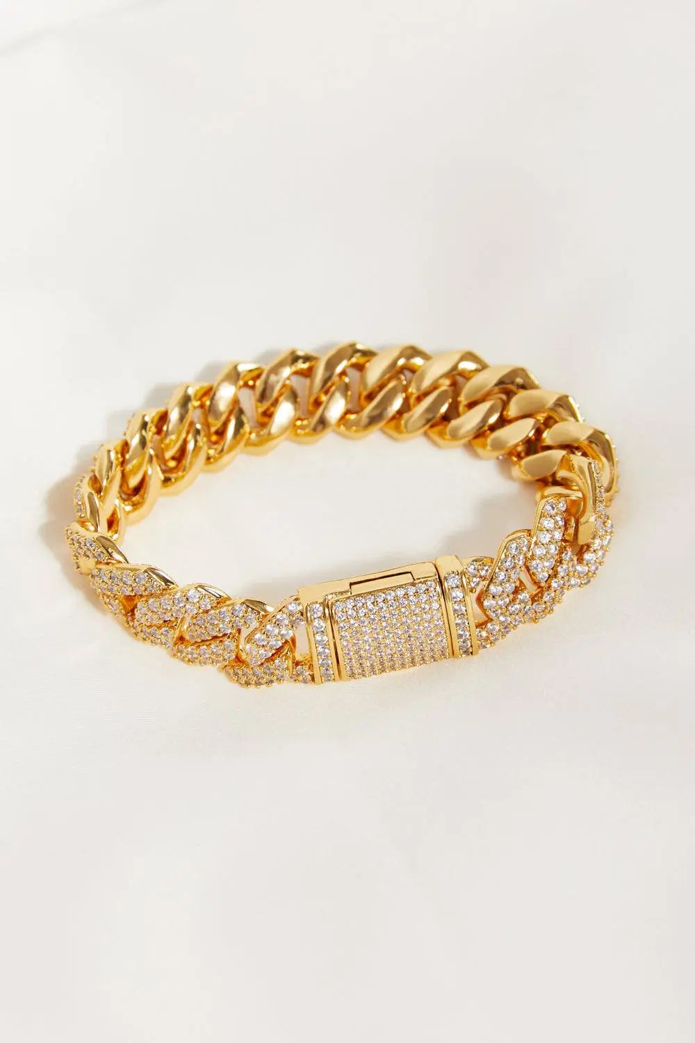 Alloy inlaid zircon bracelet with gold-plated links.