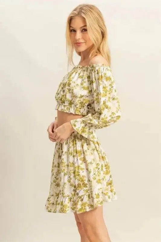 Floral off-shoulder top and skirt set with flounce sleeves.