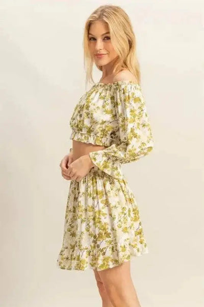 Floral off-shoulder top and skirt set with flounce sleeves.
