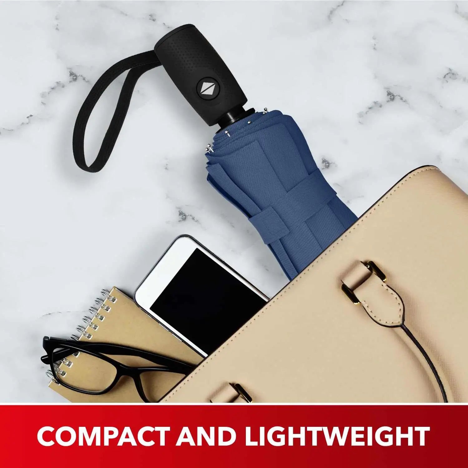 Compact and lightweight Repel Umbrella windproof travel umbrella in a bag with accessories.