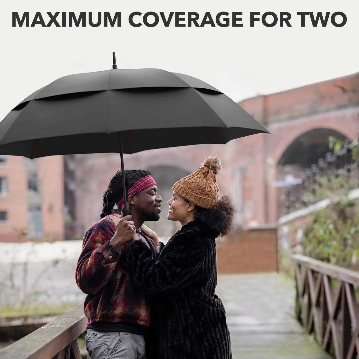 Windproof travel umbrella providing coverage for two people in the rain, featuring a durable fiberglass frame and waterproof canopy.