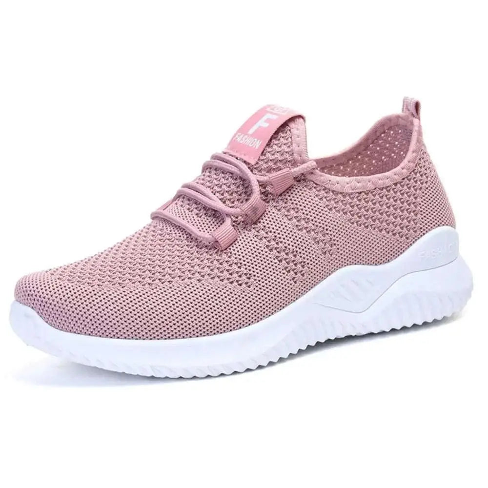 Breathable mesh lace-up athletic shoes in pink with flat sole.