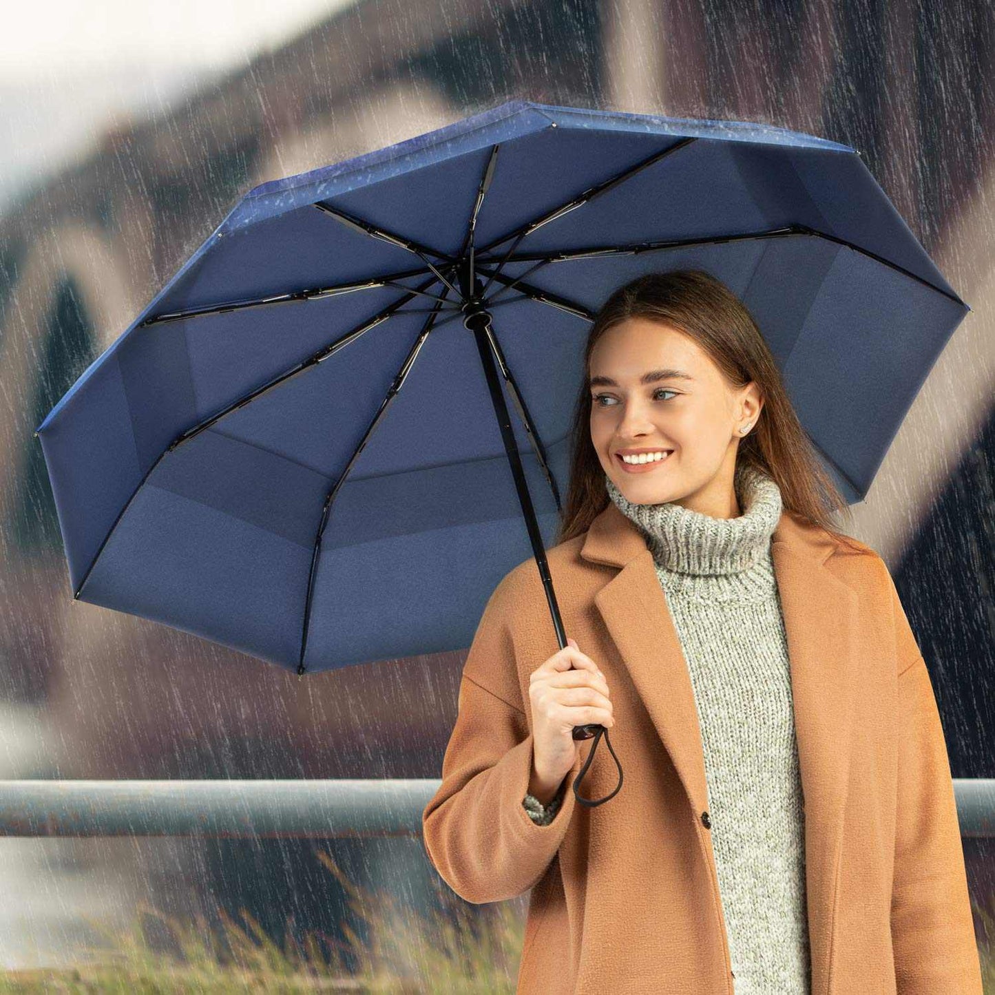 Windproof travel umbrella with strong fiberglass frame and waterproof canopy, ideal for rain protection and easy portability.