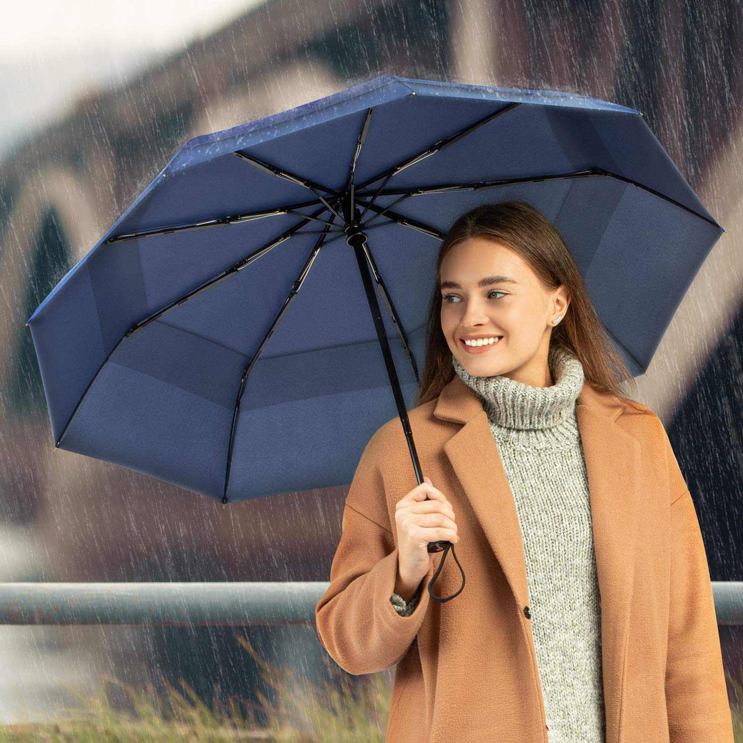 Windproof travel umbrella with strong fiberglass frame and waterproof canopy, ideal for rain protection and easy portability.