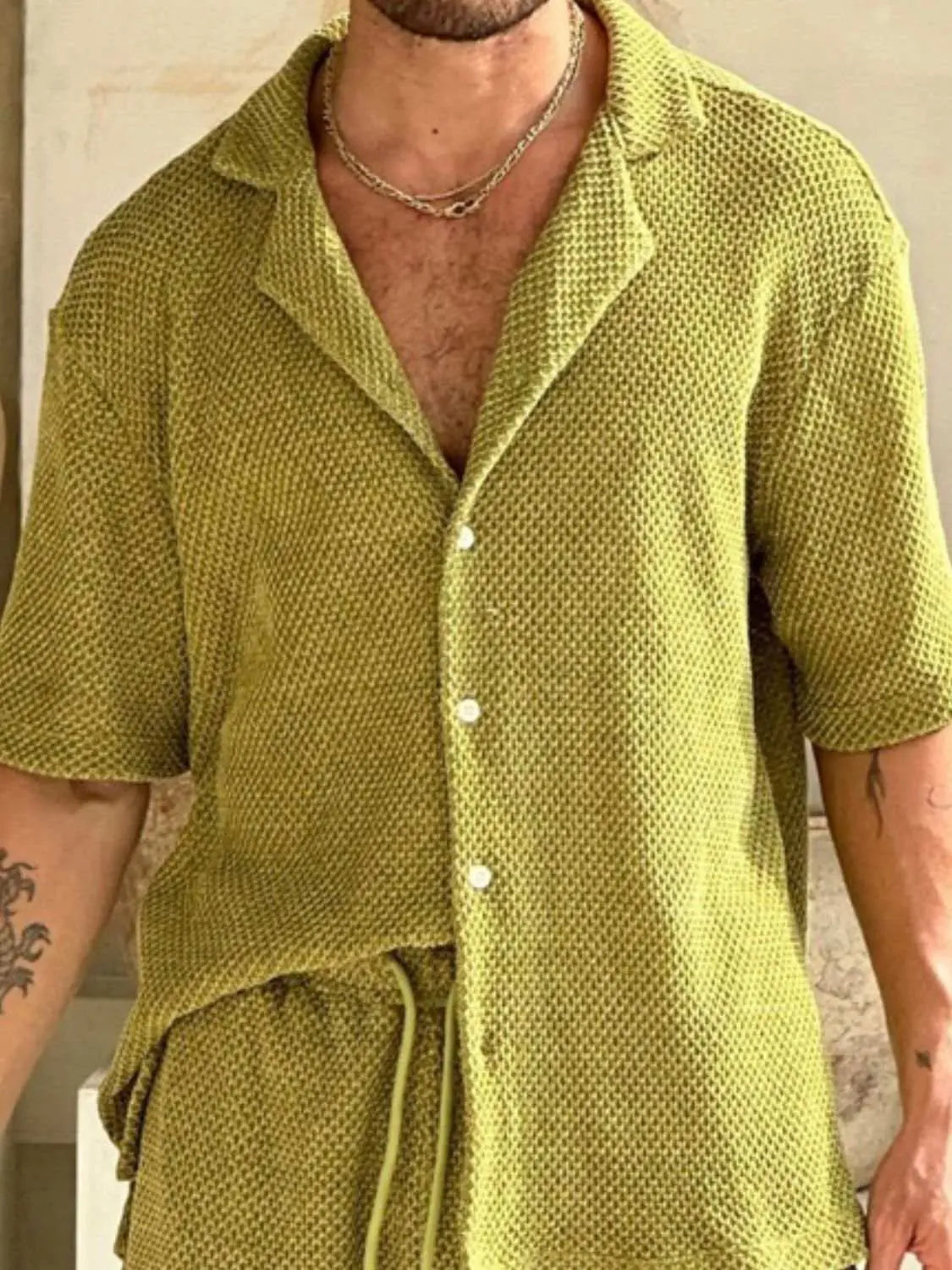 Men's plus size green button down half sleeve top and shorts set with drawstring.