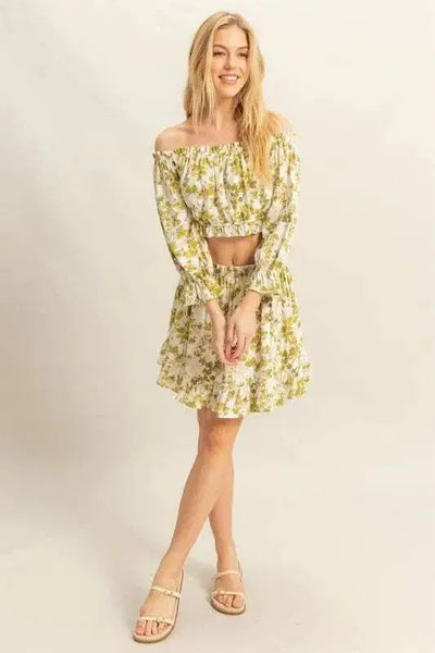 Floral off-shoulder top and skirt set with flounce sleeves.