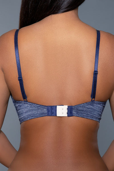 Bra extenders attached to a blue bra, providing extra length and comfort.