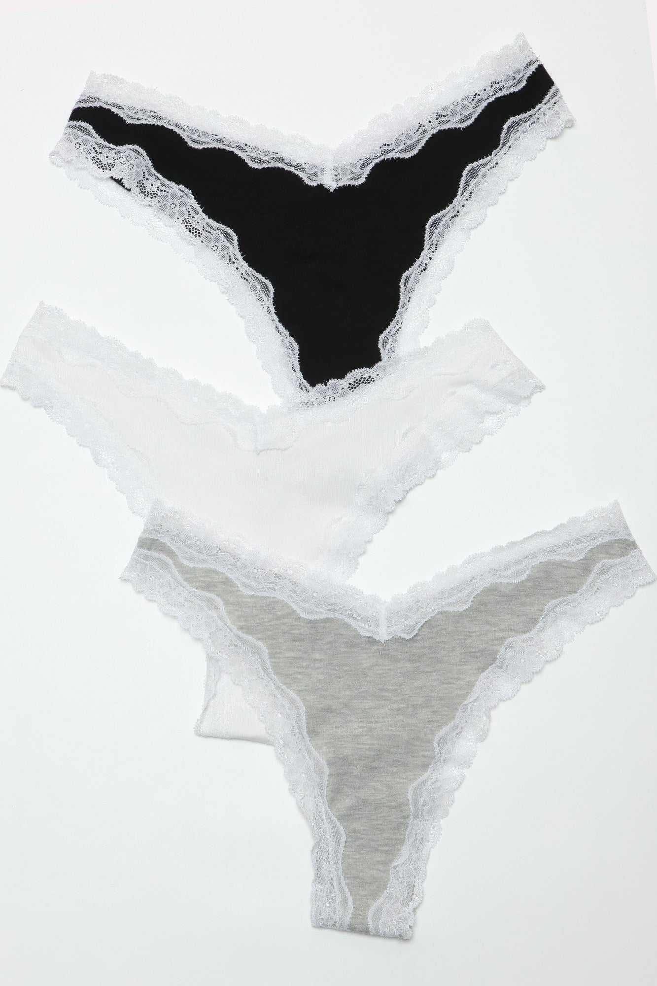 Sam Thong 3 Pack featuring soft jersey fabric thongs with contrast lace trim in assorted colors.