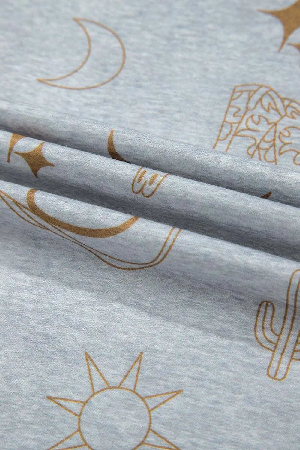 Printed T-Shirt and Elastic Waist Shorts Set with celestial designs on light gray fabric.