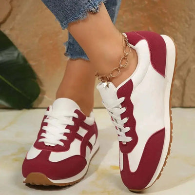 Contrast lace-up round toe sneakers with maroon and white design, PU leather and rubber material.