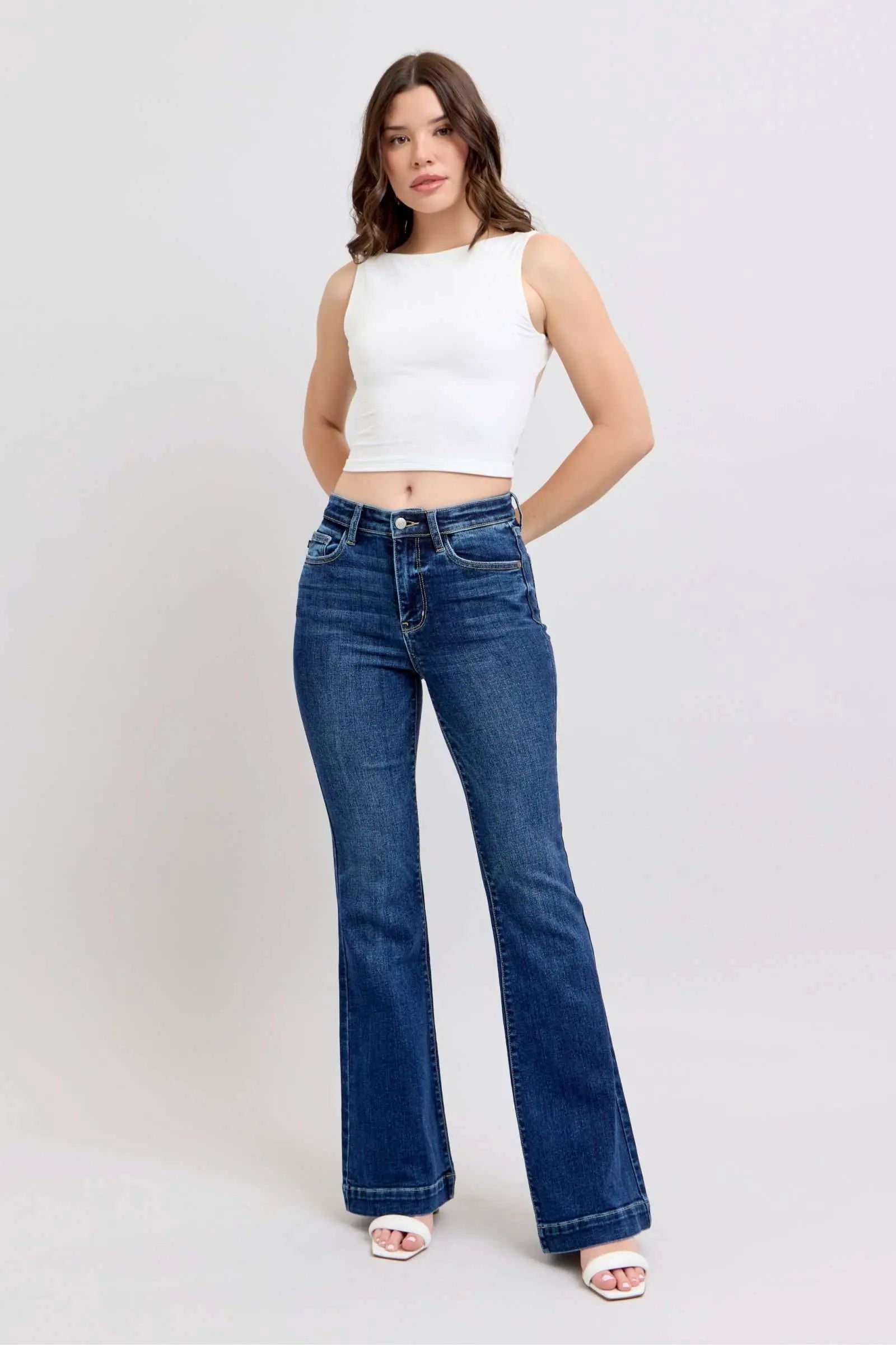 Judy Blue Full Size High Rise Flare Jeans with Pockets Plus Size, trendy high-waisted silhouette, retro flare leg, versatile style.