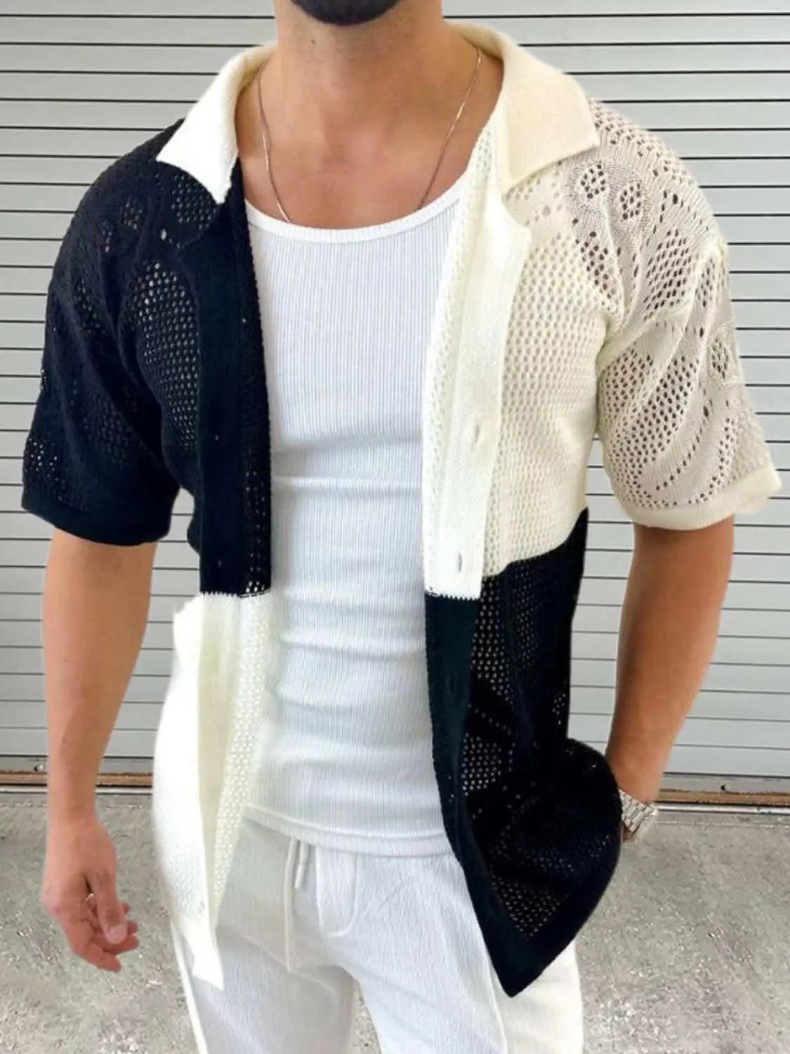 Men's contrast button down hollow out shirt in black and white, slightly stretchy polyester fabric.