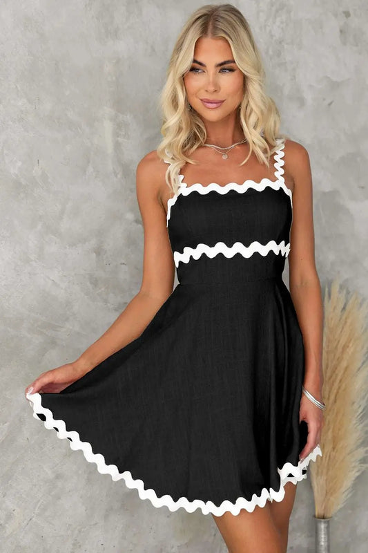 Front view of black square neck mini dress showcasing its classic silhouette and flattering fit
