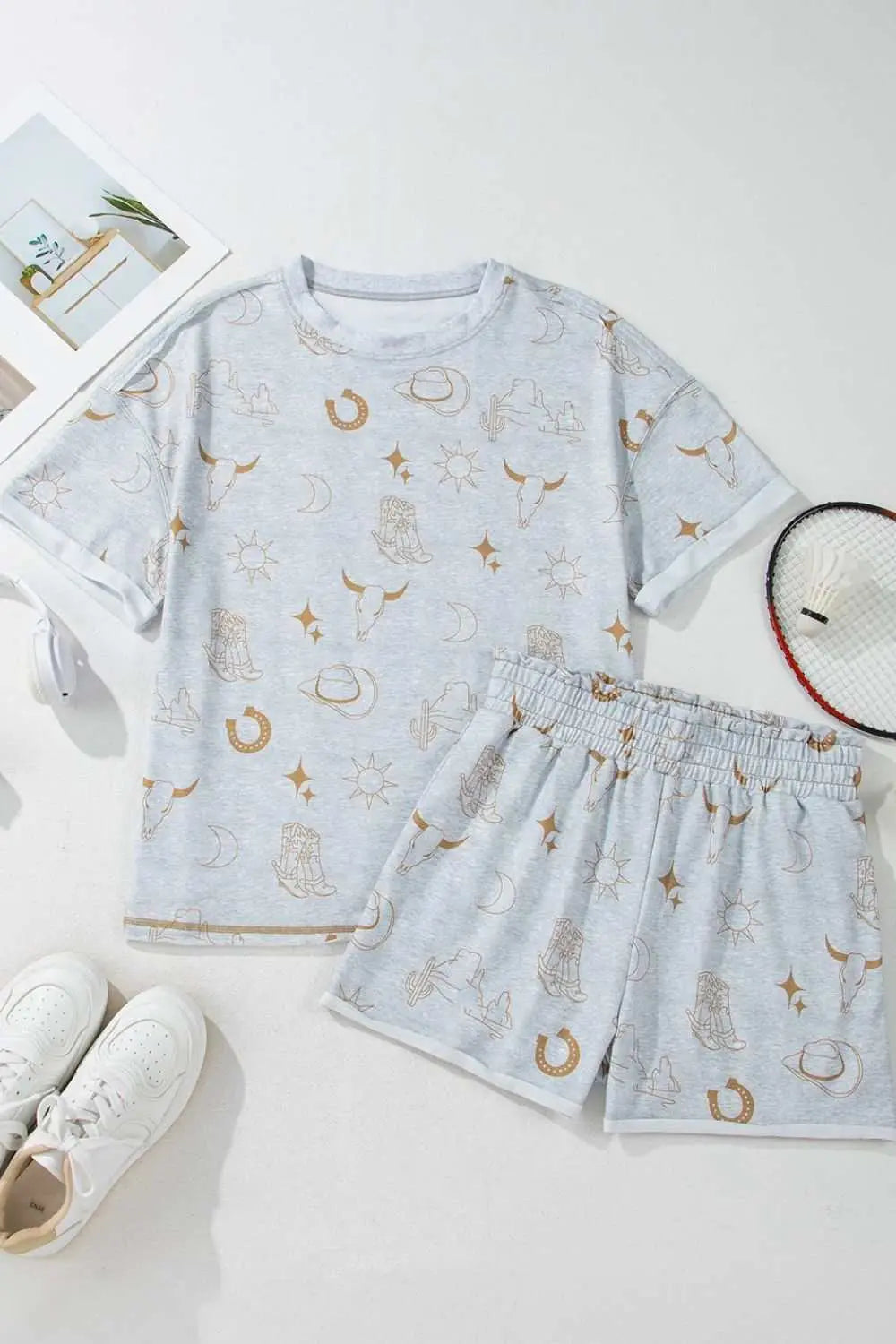 Printed T-shirt and elastic waist shorts set with celestial pattern, polyester blend.