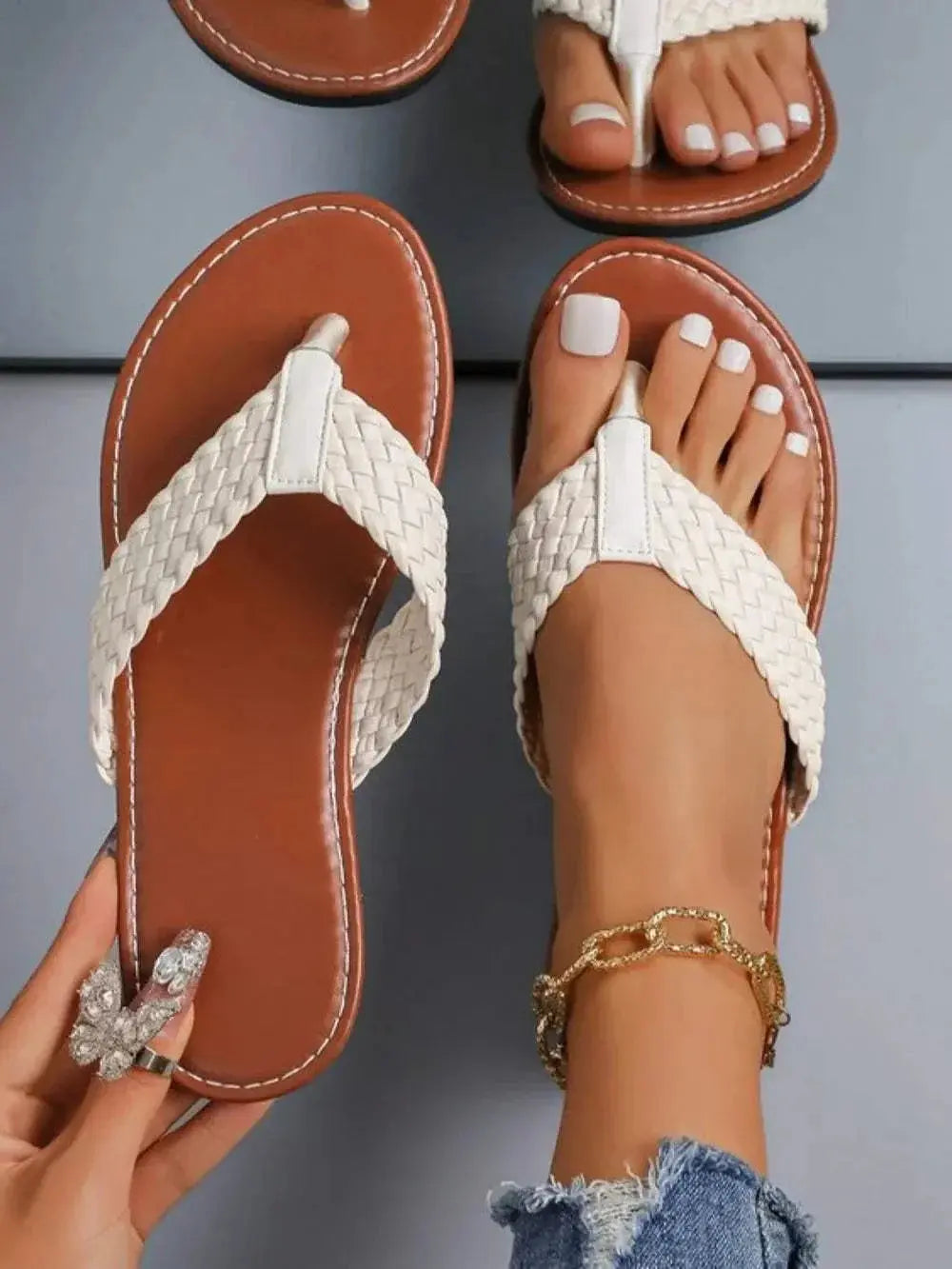 Braided toe post flats sandals in white, with rubber and PU material.