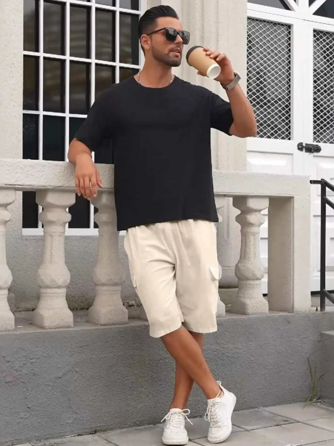 Men's full-size drawstring shorts with cargo pockets, plus size, in cream color, modeled with a black t-shirt and white sneakers.