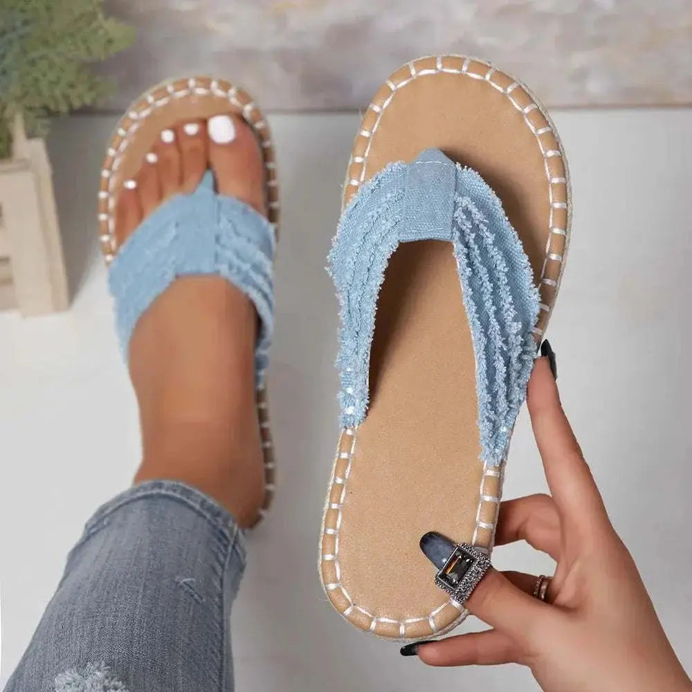 Raw hem toe post flat sandals in canvas and rubber with true-to-size fit.
